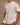 Huega House Essential Tee in Cream styled with shorts and Huega hat, relaxed everyday look